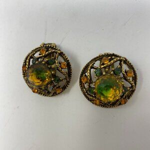 vintage unbranded clip on gold earrings w/ green & amber glass stone
